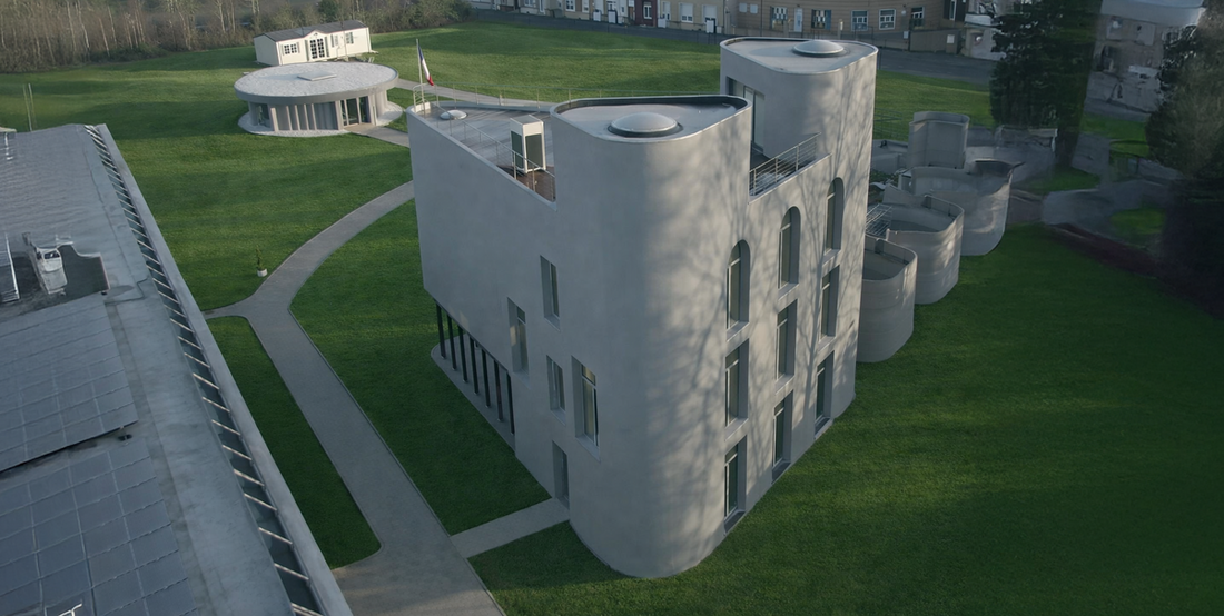 Bâtiment La Tour avec volumes courbes réalisés grâce à l’impression 3D béton